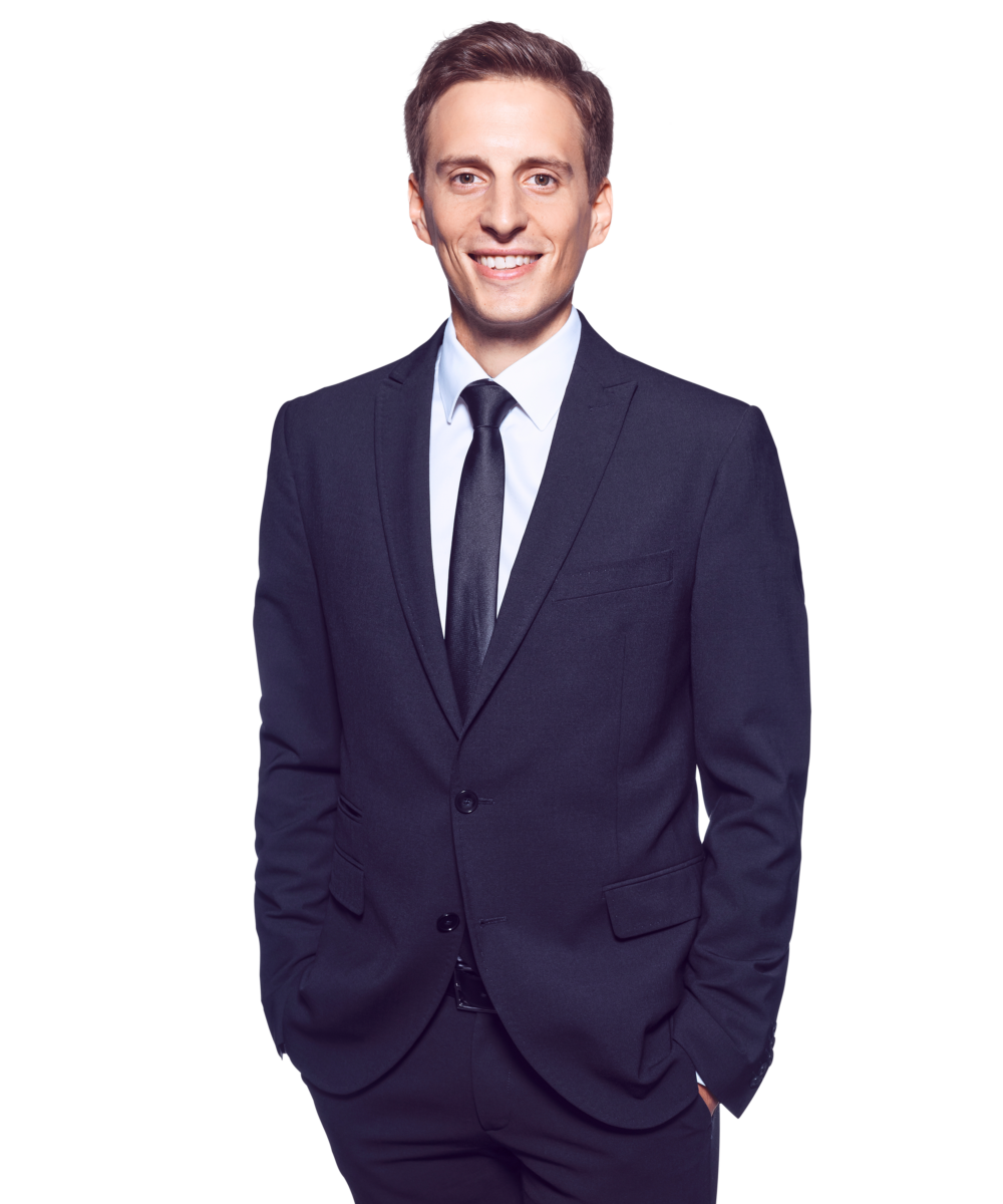 Portrait photo of Victor Gradl, Director at Kemény Boehme Consultants (KBC). A man with short dark brown hair, smiling broadly and warmly at the camera. He is wearing a dark suit with a light blue shirt and black tie, with both hands in his pants pockets.